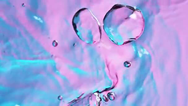 Super Slow Motion Splashing Water Illuminated Neon Lights Filmed High — Stock Video