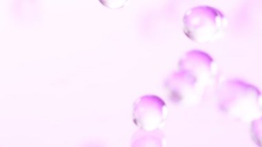 Pembe hidrojel toplarının çok yavaş düşüşü. Kozmetik, gençlik ve güzellik konsepti. Yüksek hızlı sinema kamerası, 1000fps