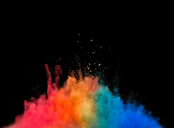 Цветной взрыв пыли на черном фоне — стоковое фото