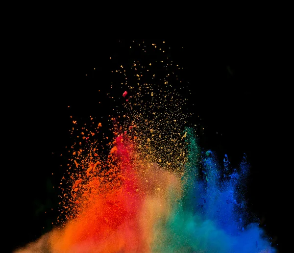 Colored dust explosion on black background — Stock Photo, Image