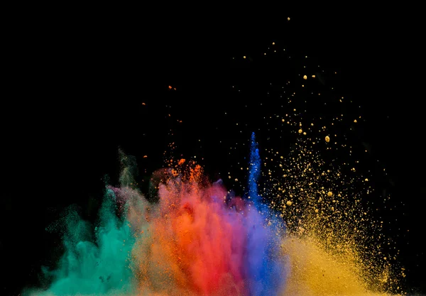 Colored dust explosion on black background — Stock Photo, Image