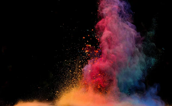 Colored dust explosion on black background — Stock Photo, Image