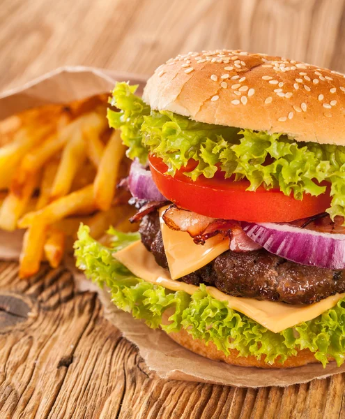 Fresh hamburger on wooden planks — Stock Photo, Image