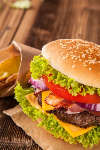 Fresh hamburger on wooden planks — Stock Photo, Image