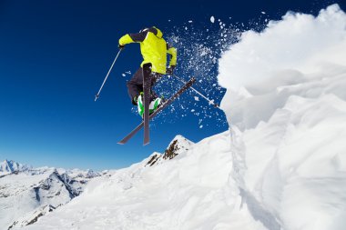 Alpine skier on piste, skiing downhill clipart