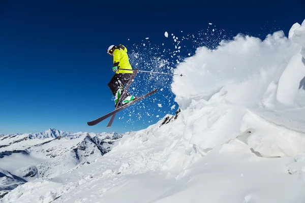 Alpine skier on piste, skiing downhill — Stock Photo, Image