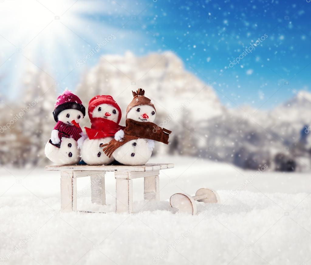 Winter snowy scenery with snow men