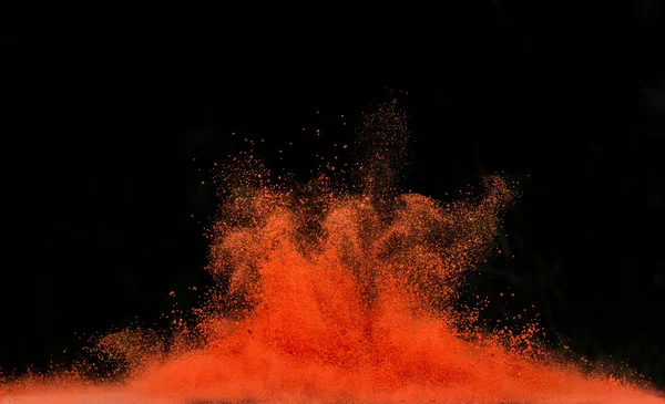 Colored dust explosion on black background — Stock Photo, Image