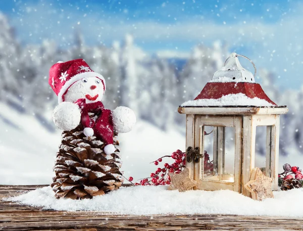Winter snowy scenery with snow man — Stock Photo, Image