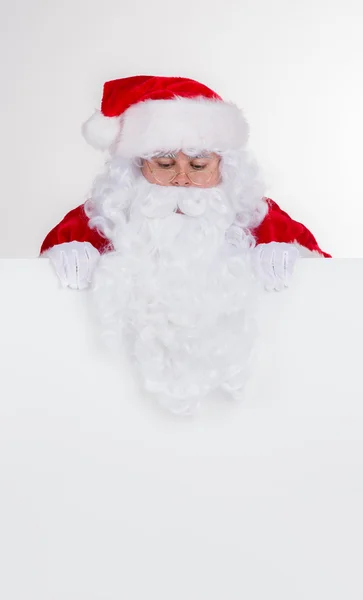 Santa claus met leeg bord — Stockfoto