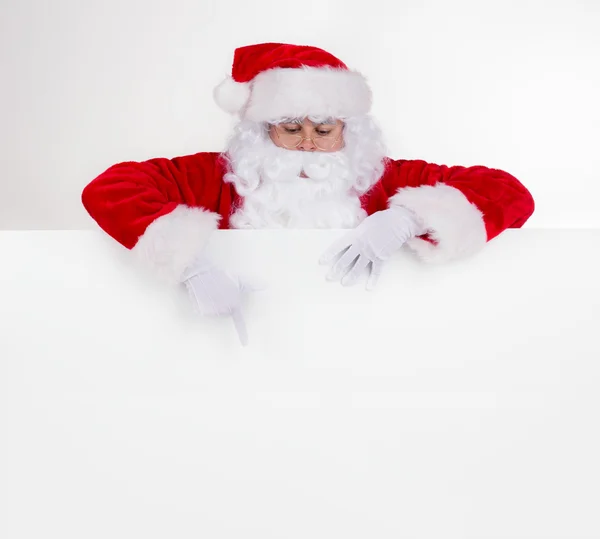 Santa claus met leeg bord — Stockfoto