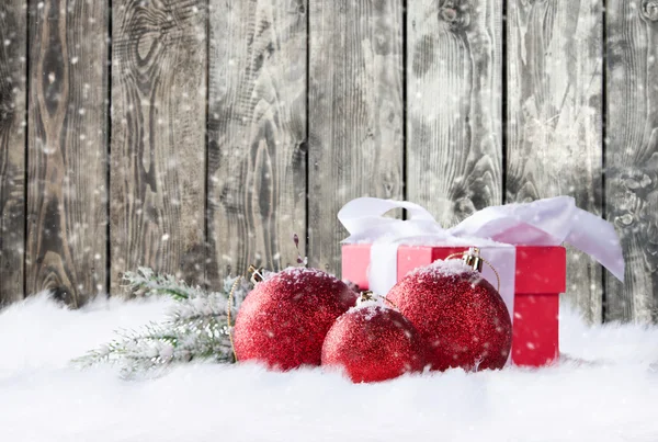 Christmas gifts in snow — Stock Photo, Image