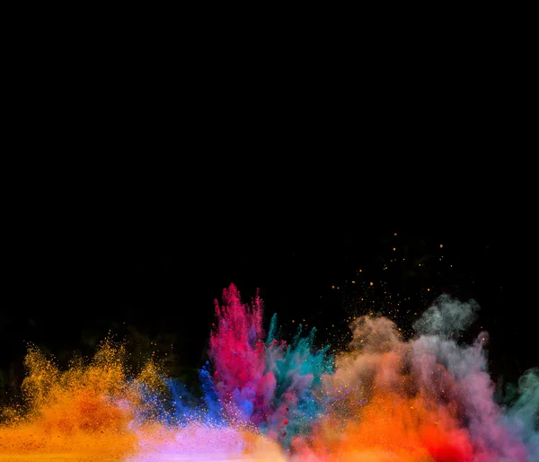 Explosão de poeira colorida no fundo preto — Fotografia de Stock