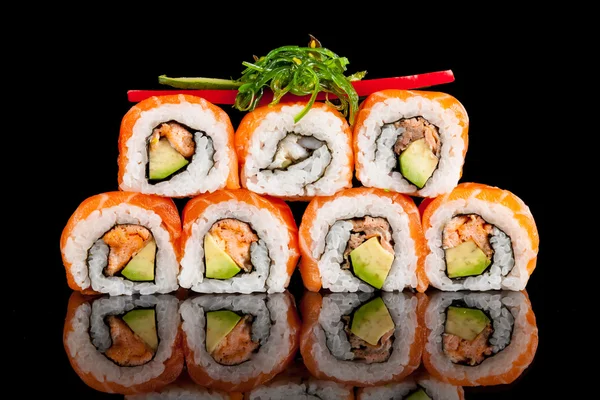 Sushi pieces on black background — Stock Photo, Image