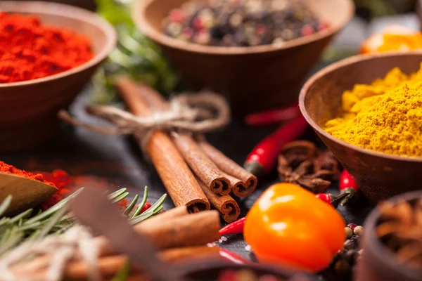 Various spices on black stone — Stock Photo, Image