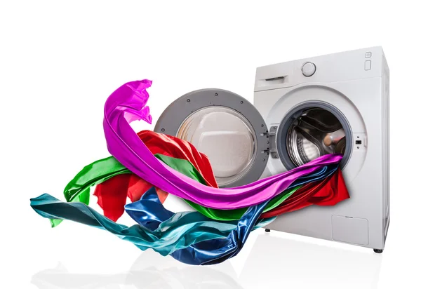 Colored cloth flying from washing machine — Stock Photo, Image