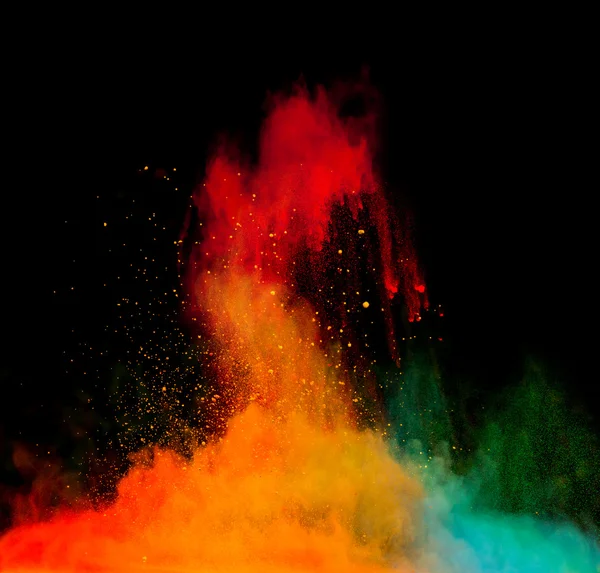 Farbige Staubexplosion auf schwarzem Hintergrund — Stockfoto