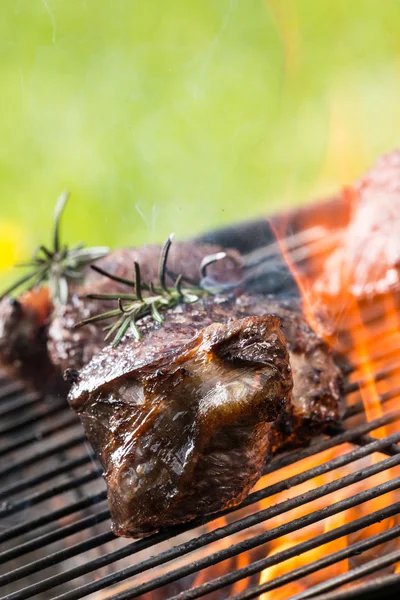 Beef steaks on grill — Stock Photo, Image