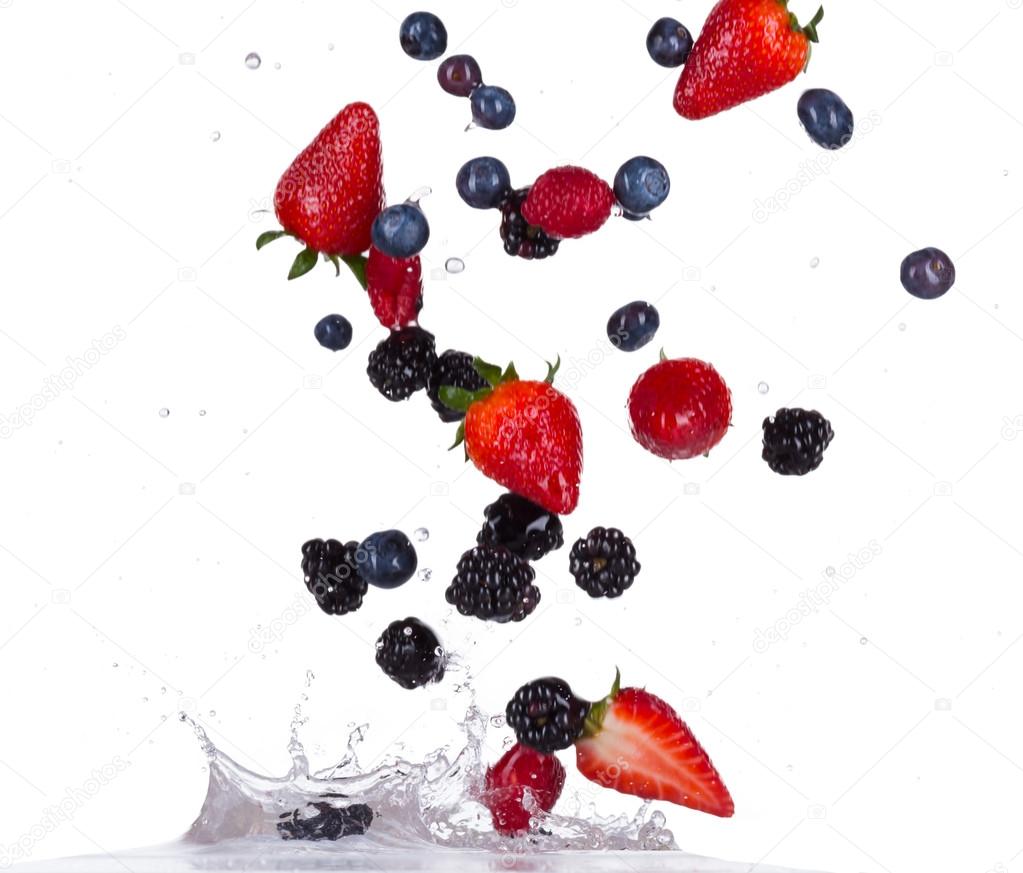 Berries fruit in water splash on white backround