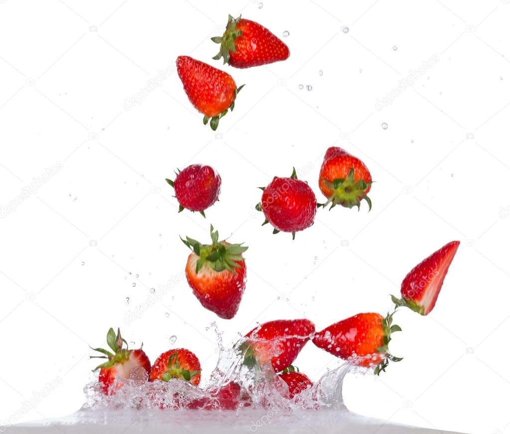 Strawberries in water splash on white backround