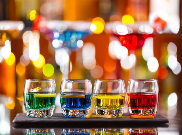 Variation of hard alcoholic shots on bar counter — Stock Image Variation of hard alcoholic shots on bar counter Royalty Free Stock Photos