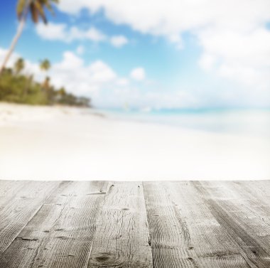 Empty wooden pier with view on sandy beach
