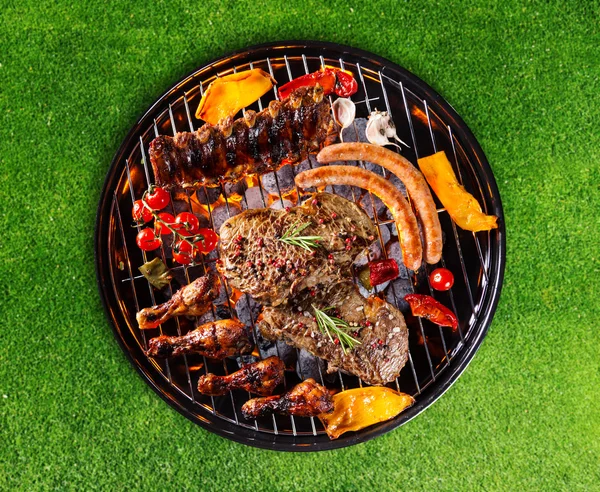 Barbecue grill with various kinds of meat — Stock Photo, Image