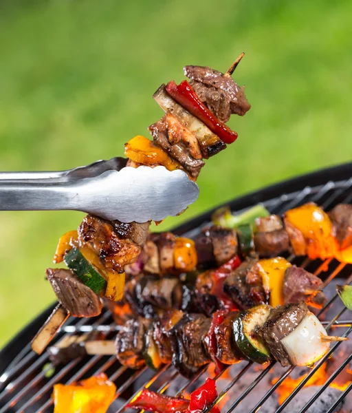 Delicious skewers on grill — Stock Photo, Image