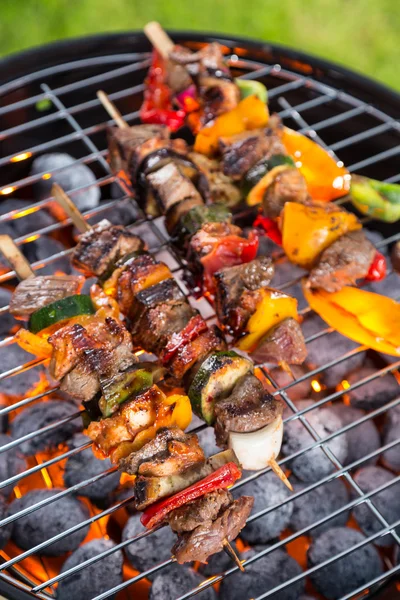 Delicious skewers on grill — Stock Photo, Image