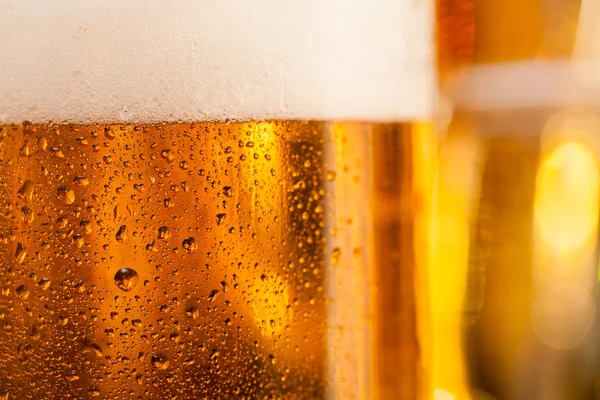 Jug of beer served on bar counter — Stock Photo, Image