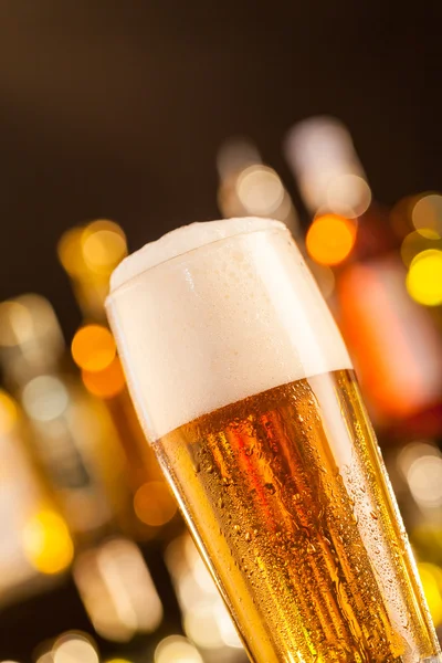 Jug of beer served on bar counter — Stock Photo, Image