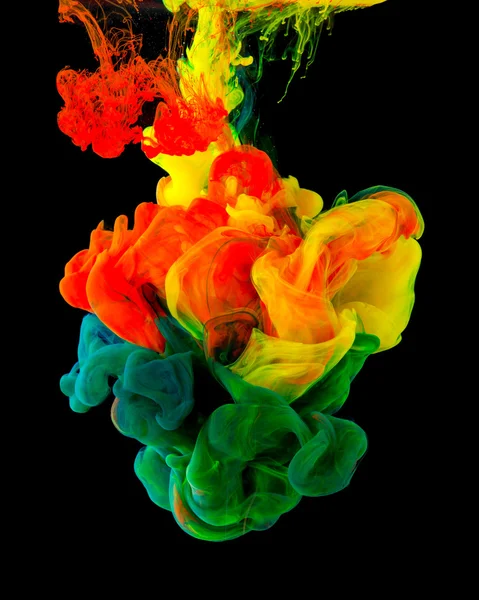 Colored ink isolated on black background — Stock Photo, Image