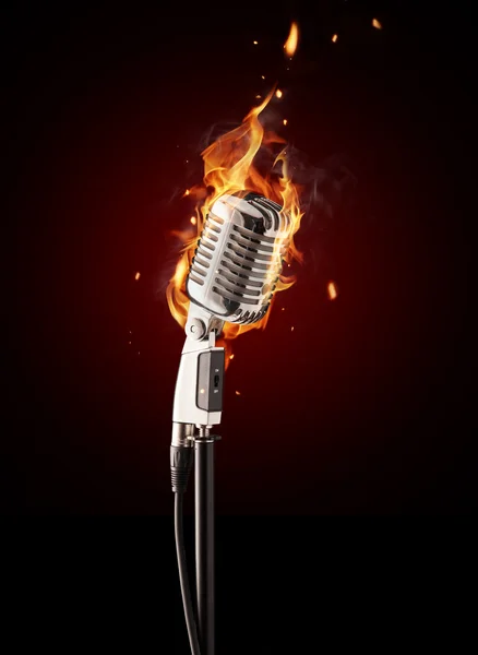 Retro singing microphone in fire — Stock Photo, Image