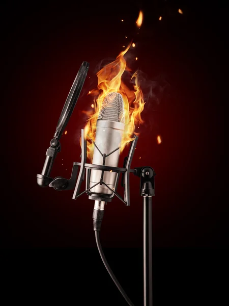 Professional singing microphone in fire — Stock Photo, Image