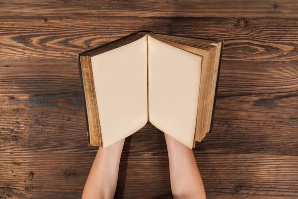 Woman hands holding blank old book — Zdjęcie stockowe