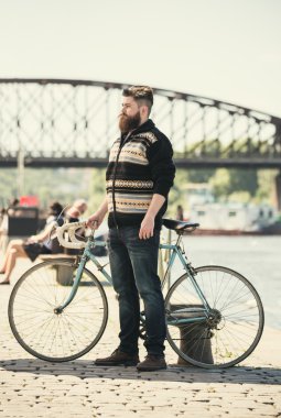 Trendy hipster young man with bycicle