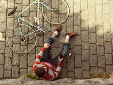 Trendy hipster young man with bycicle