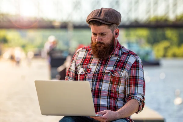 Trendy hipster young man with laptop — 스톡 사진