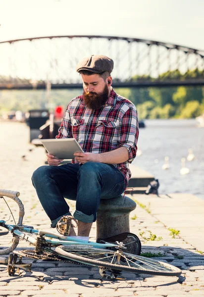 Trendy hipster young man with tablet — Stock Photo, Image