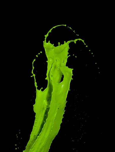 Green paint splash on black background — Stock Photo, Image