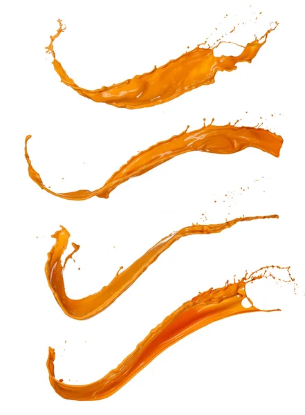Pintura naranja salpica sobre fondo blanco — Foto de Stock