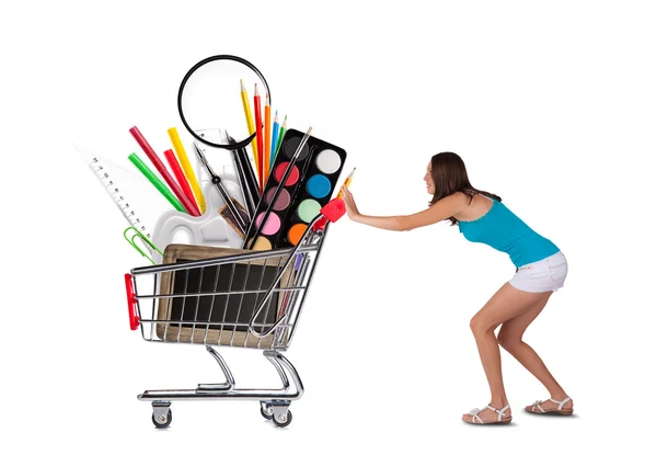 Meisje met mand vol school accessoires — Stockfoto