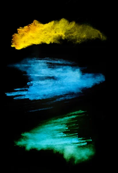 Colored powder on black background — Stock Photo, Image