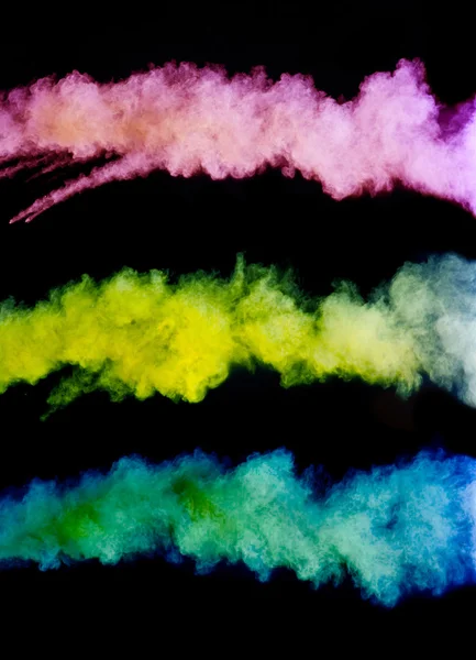 Siyah arka plan üzerinde renkli toz — Stok fotoğraf