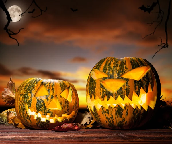 Halloween pumpkins with evening sky on background Stock Photo