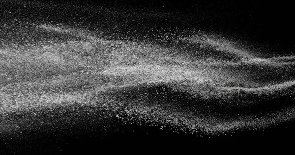 Black and white dust stream in the air. Fine particles suspended in motion on black background. Abstract slow motion texture for concepts of air, dust, purity, or science visuals.