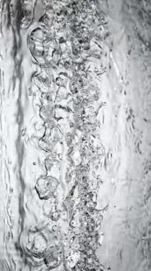 Super slow motion of impact hit of splashing water, close-up. Filmed on high speed cinema camera, 1000 fps.