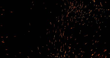 Gerçekçi ateş kıvılcımları havada uçuşuyor, siyah bir arka planda izole edilmiş. Sinematik VFX örtüsü, ateş parçacıkları etkisi ya da görsel element olarak mükemmel.
