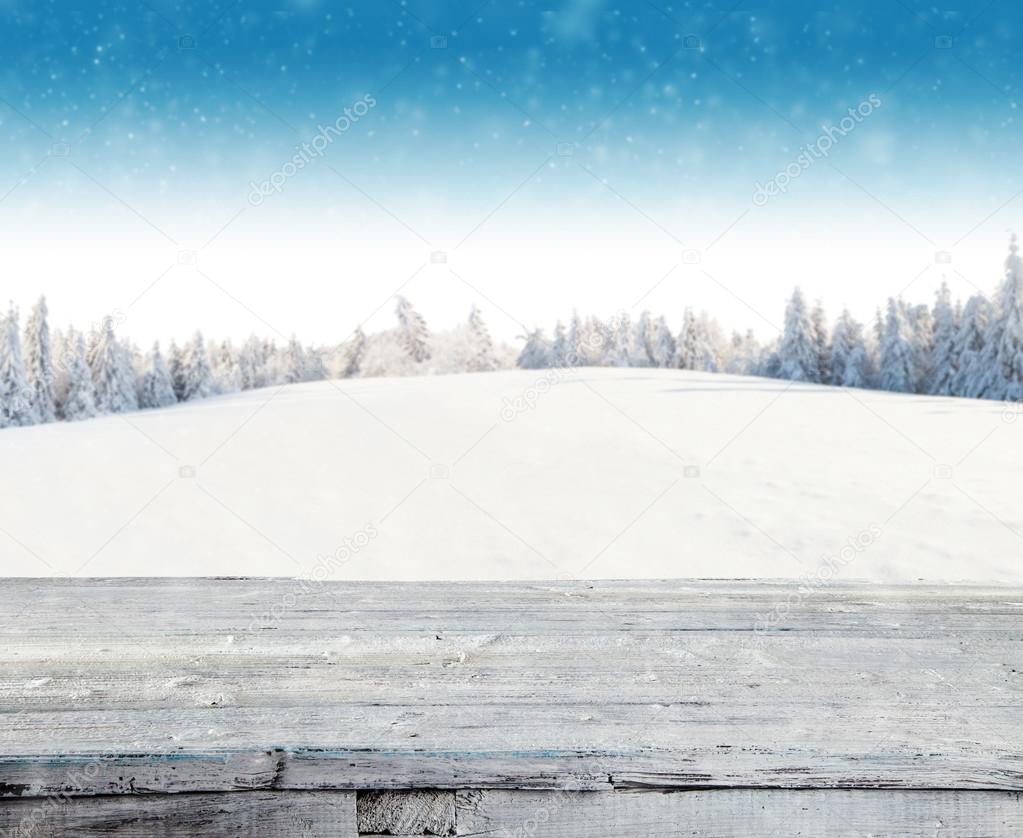 Winter snowy background with wooden planks