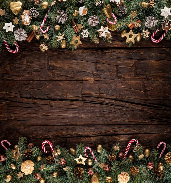 Christmas fir tree with decoration on a wooden board — Stock Photo, Image